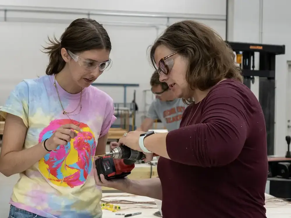 Oregon State University students collaborating at a laboratory workbench
